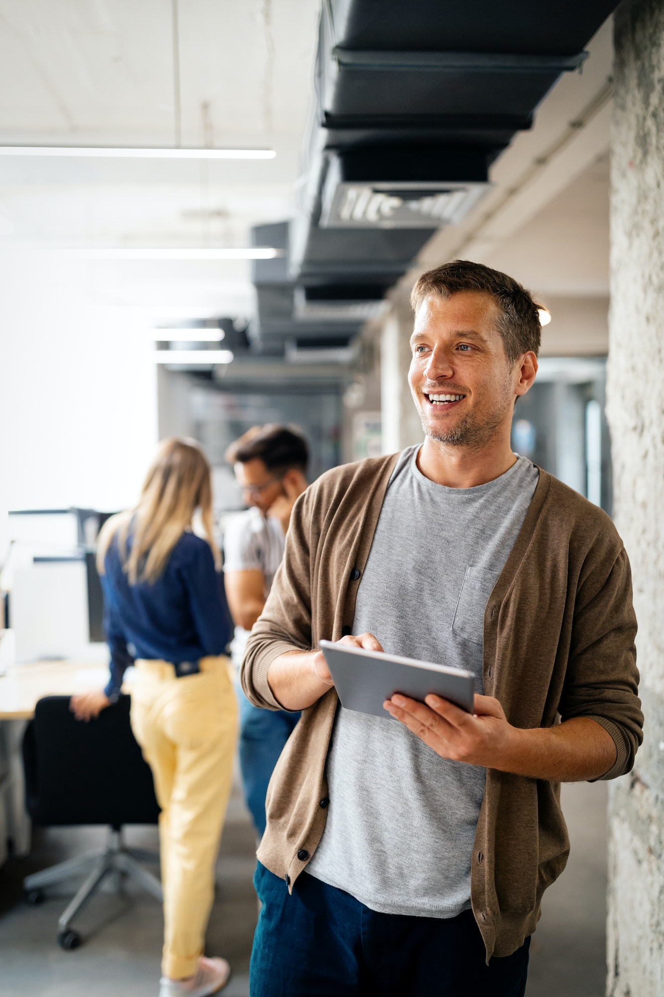 Stock photo of an employee using a tablet device